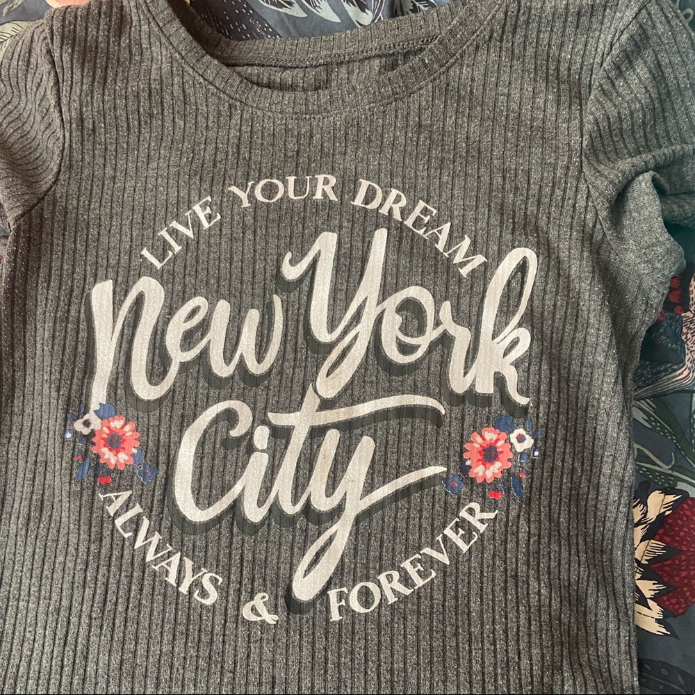 A cute gray shirt with designs